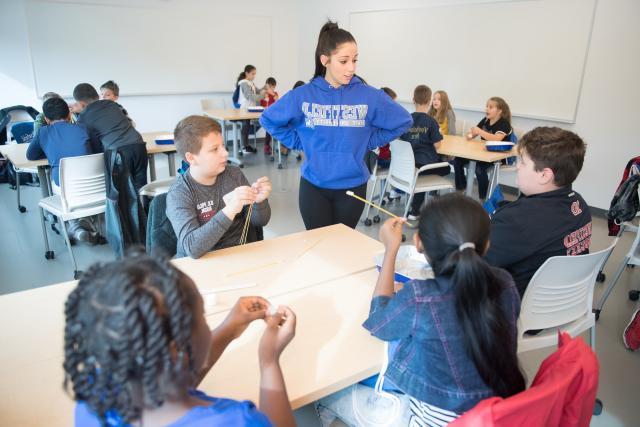 Westfield State student working with local elementary students
